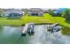 Backyard view of a lake and multiple docks at 2631 Captains Ct, Kissimmee, FL 34746