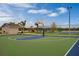 Community basketball court features bright court paint, fencing, restrooms, and a playground for Gathering enjoyment at 2660 Gouda Dr, Apopka, FL 32703