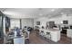 Open-concept living area with modern finishes, connecting dining area, kitchen, and seating at 2660 Gouda Dr, Apopka, FL 32703