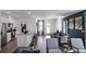 Open-concept living space seamlessly integrates the kitchen, dining, and living areas, perfect for modern living and entertaining at 2660 Gouda Dr, Apopka, FL 32703