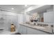 Modern bathroom with a double sink vanity featuring a granite countertop, a shower, and stylish accents at 2664 Gouda Dr, Apopka, FL 32703