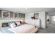 Serene bedroom featuring a plush bed, modern art, and a white dresser with clean lines and calming color palette at 2664 Gouda Dr, Apopka, FL 32703