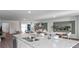 Open-concept living area with a kitchen island, dining table, and inviting living space at 2664 Gouda Dr, Apopka, FL 32703