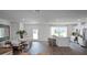 Bright and airy living space with a modern kitchen, a cozy dining area, and outdoor views at 2664 Gouda Dr, Apopka, FL 32703