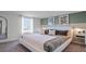 Modern bedroom featuring large windows, neutral carpet, and stylish decor at 2668 Gouda Dr, Apopka, FL 32703