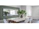 Dining area with stylish furnishings and a decorative mirror at 2668 Gouda Dr, Apopka, FL 32703
