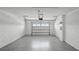 Spacious two-car garage featuring epoxy floors and ample space for vehicles and storage at 2668 Gouda Dr, Apopka, FL 32703