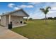 Exterior view of a community restroom featuring a drinking fountain, trash receptacle, and nearby sports field at 2668 Gouda Dr, Apopka, FL 32703