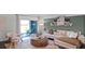 Cozy living room area featuring stylish furniture, contemporary decor, and sliding glass door at 2672 Gouda Dr, Apopka, FL 32703