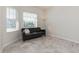 Bright living room featuring tile floors and natural light from the windows at 2738 Norway Maple Ct, Ocoee, FL 34761