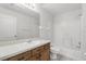 This bathroom is well lit and equipped with a toilet, tub/shower combo, and vanity at 2740 Regency Oak Ln, Orlando, FL 32833