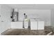 A utilitarian laundry room is equipped with a washer, dryer, and water heater at 2740 Regency Oak Ln, Orlando, FL 32833