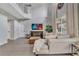 Open-concept living area with soaring ceilings and tile floors and second story walkway at 2801 Lido Key Ct, Kissimmee, FL 34747