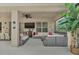 Spacious covered patio with ample seating and a television for outdoor entertaining at 2801 Lido Key Ct, Kissimmee, FL 34747
