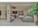 Spacious covered patio with ample seating and a television for outdoor entertaining at 2801 Lido Key Ct, Kissimmee, FL 34747