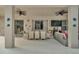 Spacious covered patio with ample seating, a dining table, and a television for outdoor entertaining at 2801 Lido Key Ct, Kissimmee, FL 34747