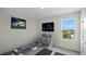 Well-equipped home gym featuring weights, exercise equipment, and a TV for an active lifestyle at 2936 Moulin Rd, Davenport, FL 33837