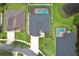 Aerial view of home featuring a private pool, fenced yard, lush landscaping, and a well-maintained lawn at 3180 Pawleys N Loop, St Cloud, FL 34769