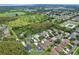 Picturesque aerial of a community showcasing homes, lush greenery, and surrounding natural beauty at 3180 Pawleys N Loop, St Cloud, FL 34769