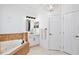 Bright bathroom with white cabinets, soaking tub with tile surround, and tile floors at 3180 Pawleys N Loop, St Cloud, FL 34769