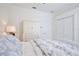 Comfortable bedroom featuring light colored wooden furniture, and blue accent pillows at 3180 Pawleys N Loop, St Cloud, FL 34769
