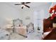 Charming bedroom featuring a wrought iron bed and decorative accents throughout at 3180 Pawleys N Loop, St Cloud, FL 34769