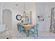 Cozy dining area with stylish chairs, chandelier, and decorative accents at 3180 Pawleys N Loop, St Cloud, FL 34769