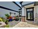 Inviting patio featuring a comfortable bench, charming decorations, and a stylish entrance door at 3180 Pawleys N Loop, St Cloud, FL 34769