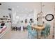 Open concept kitchen and dining area with breakfast bar and chandelier at 3180 Pawleys N Loop, St Cloud, FL 34769