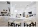 Open kitchen with a large island, breakfast bar, and modern appliances at 3180 Pawleys N Loop, St Cloud, FL 34769