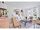 Cozy living room with elegant decor, large windows, and comfortable seating, creating a bright and inviting space at 3180 Pawleys N Loop, St Cloud, FL 34769