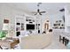Comfortable living room with built-in shelving, bar, and stylish furnishings at 3180 Pawleys N Loop, St Cloud, FL 34769