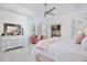 Bright main bedroom with tray ceiling, sitting area, and stylish decor at 3180 Pawleys N Loop, St Cloud, FL 34769