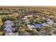 Expansive aerial view of a residential area surrounded by lush trees and landscaping at 3214 Regal Crest Dr, Longwood, FL 32779