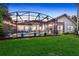 Spacious backyard with green lawn, patio, pool, and mature trees at 3214 Regal Crest Dr, Longwood, FL 32779