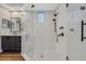 Modern bathroom features a large glass shower and sleek vanity with dark cabinets at 3214 Regal Crest Dr, Longwood, FL 32779