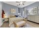 This bedroom is designed with soft tones, natural textures and plenty of sunlight at 3214 Regal Crest Dr, Longwood, FL 32779