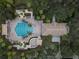 Aerial view of a community pool area with a large pool, lounge chairs, and a central fountain at 3214 Regal Crest Dr, Longwood, FL 32779