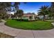 Well-maintained exterior of a home with a green lawn, mature trees, and a sidewalk at 3214 Regal Crest Dr, Longwood, FL 32779