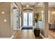 Elegant foyer with hardwood floors, decorative lighting, and a view of the dining room at 3214 Regal Crest Dr, Longwood, FL 32779