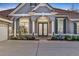 Elegant front entrance showcasing double doors with decorative glass and white columns at 3214 Regal Crest Dr, Longwood, FL 32779