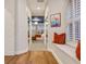 Hallway leads to the main bedroom and includes a window seat with cozy pillows at 3214 Regal Crest Dr, Longwood, FL 32779