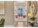 Hallway view of a nook with a window seat and orange pillows with wood-look floors at 3214 Regal Crest Dr, Longwood, FL 32779