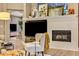 Cozy living room with a fireplace and a large television with natural light at 3214 Regal Crest Dr, Longwood, FL 32779