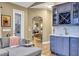 Stylish wet bar area complete with cabinetry and beverage storage, open to the main living area at 3214 Regal Crest Dr, Longwood, FL 32779