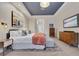 Spacious main bedroom with a blue accent ceiling and a large bed at 3214 Regal Crest Dr, Longwood, FL 32779