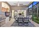 Covered patio with dining table, grill, ceiling fan, and view of the backyard at 3214 Regal Crest Dr, Longwood, FL 32779
