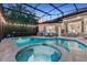 Inviting screened-in pool and spa area with ample seating, perfect for outdoor entertaining at 3214 Regal Crest Dr, Longwood, FL 32779