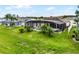 An aerial perspective reveals the pool, screened patio, and expansive backyard at 335 Prestwick Dr, Davenport, FL 33897