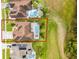Aerial view showcasing property, inground pool, and well-manicured yard at 335 Prestwick Dr, Davenport, FL 33897